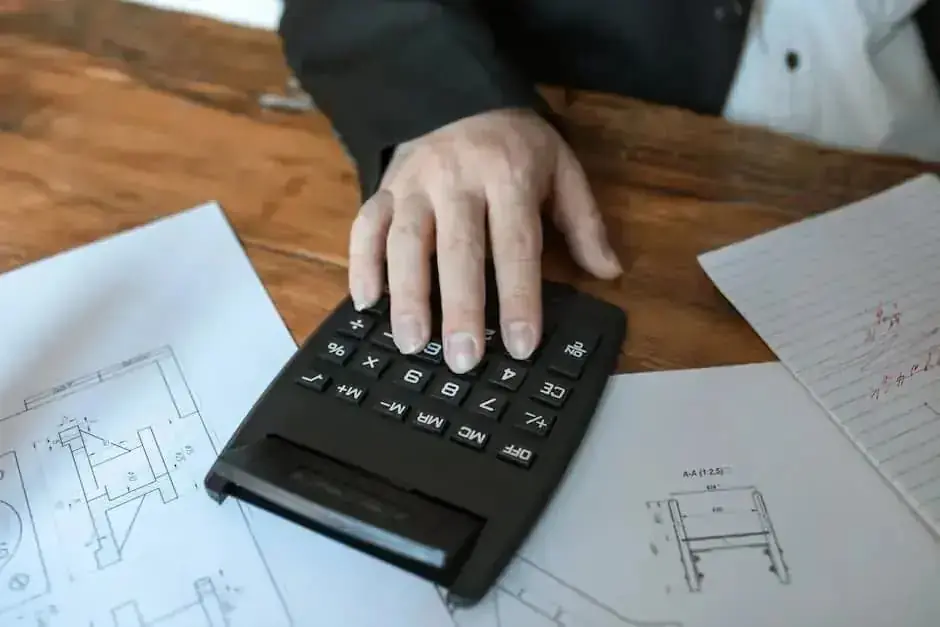 Office desk with calculator and papers representing presumptive taxation